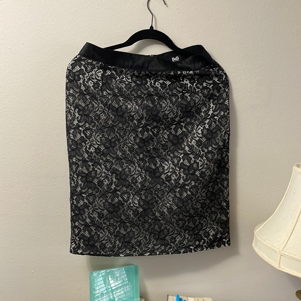 D&G black skirt with mesh overlay floral print. mid length skirt. To the knee.